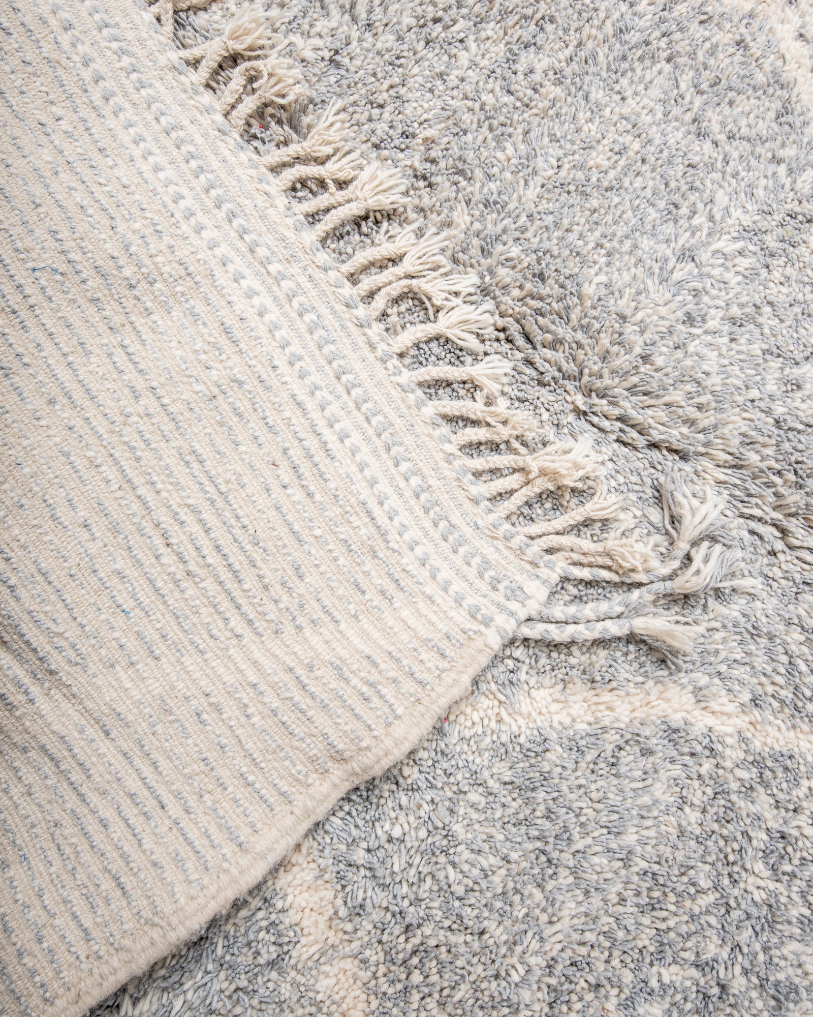 Modern, designer, handcrafted Berber rug from Morocco. Beniourain carpet with beautiful colours and patterns and fluffy wool texture.